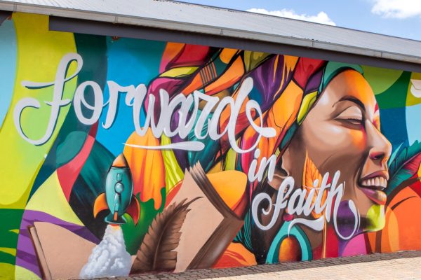 Community mural at Mamelodi High School by Strange Harvest — large‑scale graffiti style exterior wall painting in Tshwane, South Africa. 2